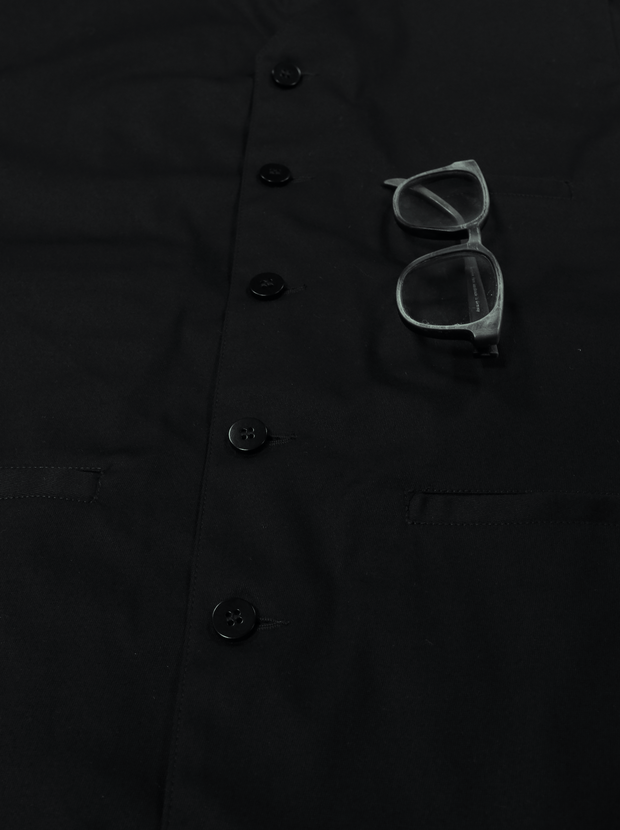 gilet à poches passepoilées en serge de coton noire