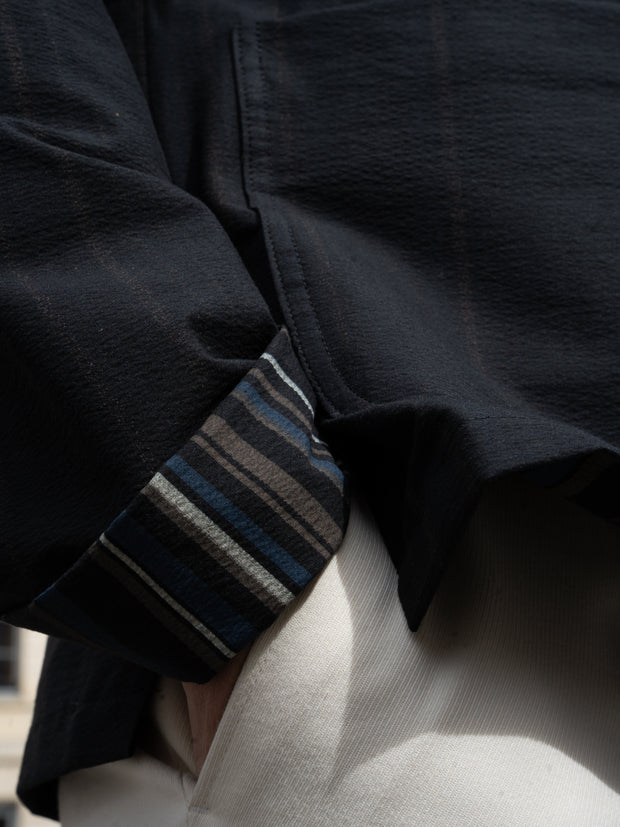 naipaul jacket with mao collar in black double-sided seersucker with irregular Scandinavian stripes